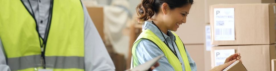 workers in yellow vests in a warehouse