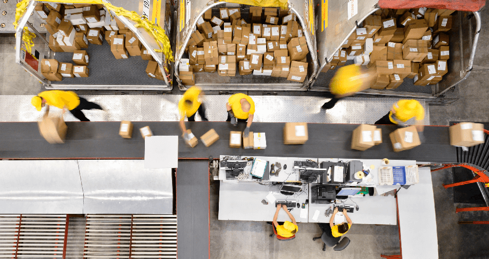 people sorting packages in a warehouse